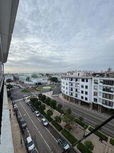 a view of a city with cars parked on a street at Babrabat in Rabat