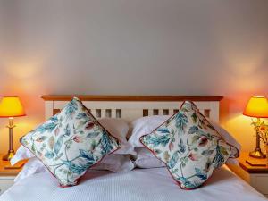 a bed with two pillows on it with two lamps at 2 Bed in Ripon oc-94559 in Masham +6 photos