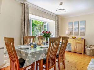 a kitchen and dining room with a table and chairs at 4 Bed in Dorchester oc-92413 in Frome Vauchurch