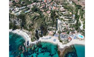 an aerial view of a resort next to the ocean at VILLA MARELUNA - near the beach , family residence pet friendly ! in Capo Vaticano
