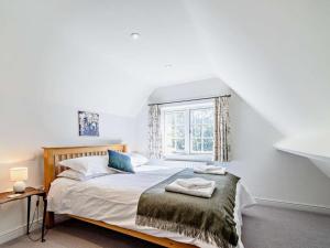 a bedroom with a bed and a window at 2 Bed in Driffield oc-75583 in Lund