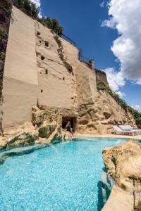 a person sitting in a water slide at a water park at San Francesco al Monte in Naples