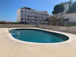 a swimming pool in the middle of a building at El Campello Beach Sea in El Campello +9 photos
