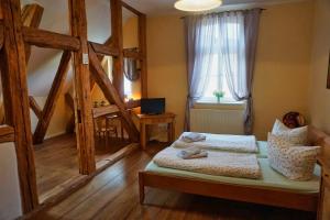 a bedroom with a bed and a window at Haus Seenland in Feldberg