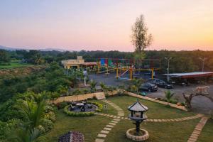 an aerial view of a park with a playground at The Crystal Woods Resort in Mendarda