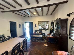 a living room with a couch and a table at Sofia House - Beach Paradise with Kite, Dive and more in Watamu
