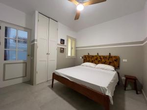 a bedroom with a bed and a ceiling fan at Extraordinary sea view in Sal Rei