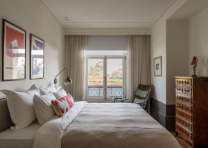 a bedroom with a large bed and a window at Hovagimyan Hotel and Suites in Istanbul