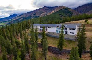 an aerial view of a house in the mountains at Hostería Huinganco in Huinganco +18 photos