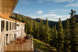 a deck on a house with a view of the mountains at Hostería Huinganco in Huinganco