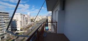 a balcony of a building with a view of a street at Apartament martin 3 in Vlorë