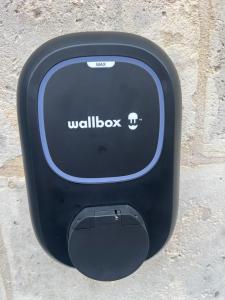 a black wall box sitting on the ground at Maison cosy avec jacuzzi privatif proche Reims in Braine +63 photos