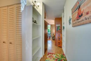 a hallway with white closets in a house at First Responders Book With Us - Kona Islander Inn! in Kailua-Kona +18 photos