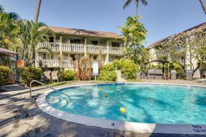 a large swimming pool in front of a building at First Responders Book With Us - Kona Islander Inn! in Kailua-Kona