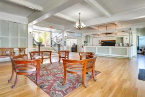 a dining room with a table and chairs at First Responders Book With Us - Kona Islander Inn! in Kailua-Kona