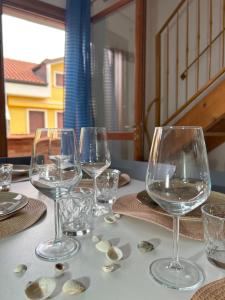 a group of wine glasses sitting on a table at Residence Sole&Mare in Rosapineta
