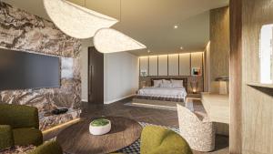 a hotel room with a bed and a television at Radisson Blu Medlock Hotel, Manchester in Manchester