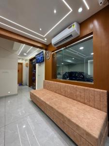 a waiting room with a bench in a building at Hotel Kavita Inn in Ujjain +70 photos