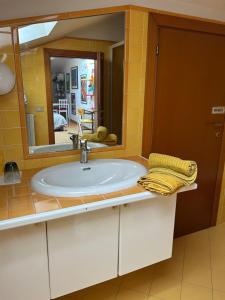 a bathroom with a sink and a mirror at A Modo Mio - Monolocale - Zona Stadio Ospedale Maggiore in Bologna