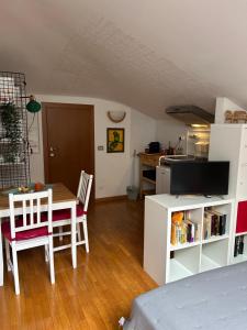 a kitchen and dining room with a table and chairs at A Modo Mio - Monolocale - Zona Stadio Ospedale Maggiore in Bologna