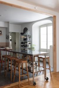a dining room with a table and some chairs at Etagevåning på Stora torget in Visby +30 photos