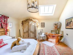 a bedroom with a bed with a teddy bear on it at 2 Bed in York oc-g0073 in Ellerton