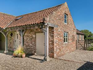 a brick house with a garage in front of it at 2 Bed in York oc-g0073 in Ellerton +11 photos