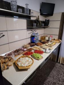 a buffet with many different types of food on a table at MOFT Borsa in Statjunea Borsa
