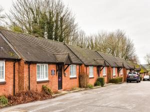 a row of brick houses in a parking lot at Mundy Arms Hotel Derby in Derby