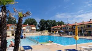 a pool at a hotel with people swimming in it at Residence Sole&Mare in Rosapineta