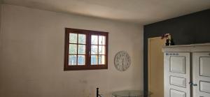 a room with a window and a glass table at Studio plainpied in Saint-Doulchard