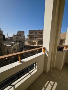 a balcony with a view of a city at Swisstay Downtown Cairo in Cairo