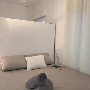 a bedroom with a bed with a pillow and a mirror at Instant Angers Hyper Centre in Angers