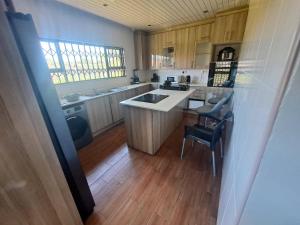 a kitchen with a sink and a counter top at Bulawayo Bliss - Cozy 3 Bedroom House in Bulawayo