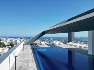 a swimming pool on the roof of a building at Nurel Shark Residence in Kyrenia