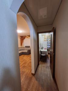 a hallway leading to a living room with a couch at Терновской район in Kryvyi Rih