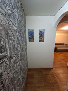 a wall with drawings on it in a room at Терновской район in Kryvyi Rih