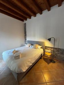 a bedroom with a bed in a room with a lamp at Vittoria in Brescia