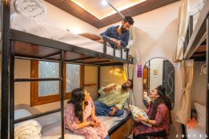 a group of people in a bunk bed room at Zostel Varanasi in Varanasi