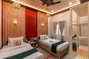 a bedroom with two beds and a bunk bed at Zostel Varanasi in Varanasi +24 photos