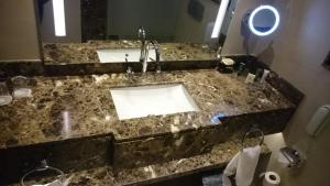 a bathroom counter with a sink and a mirror at Sharm Dreams timeshare in Sharm El Sheikh