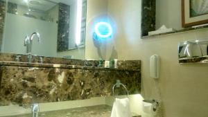 a bathroom with a blue light on the wall at Sharm Dreams timeshare in Sharm El Sheikh