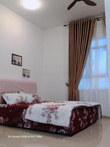 a bedroom with a bed and a window at Mesahill Home Stay Nilai in Nilai +15 photos
