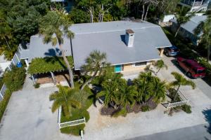 an overhead view of a house with palm trees at Palm Haven Beach Side Villa in Holmes Beach