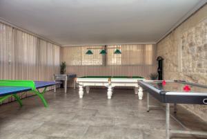 a room with two ping pong tables in it at Golden Estate - גולדן אסטייט in Safed