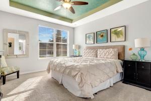 a bedroom with a bed and a ceiling fan at Ev1339 - Sunset Palm Retreat in Davenport