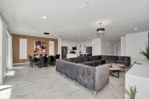 a living room with a couch and a table at Ev2613 - Grand Horizon Manor in Kissimmee +32 photos