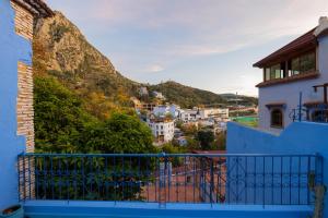 a view of a town from a balcony of a house at Casa Panorama in Chefchaouen