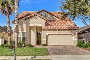 a house with a garage and palm trees at Ev1339 - Sunset Palm Retreat in Davenport