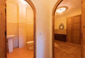 a bathroom with a toilet and a sink at Casa Panorama in Chefchaouen